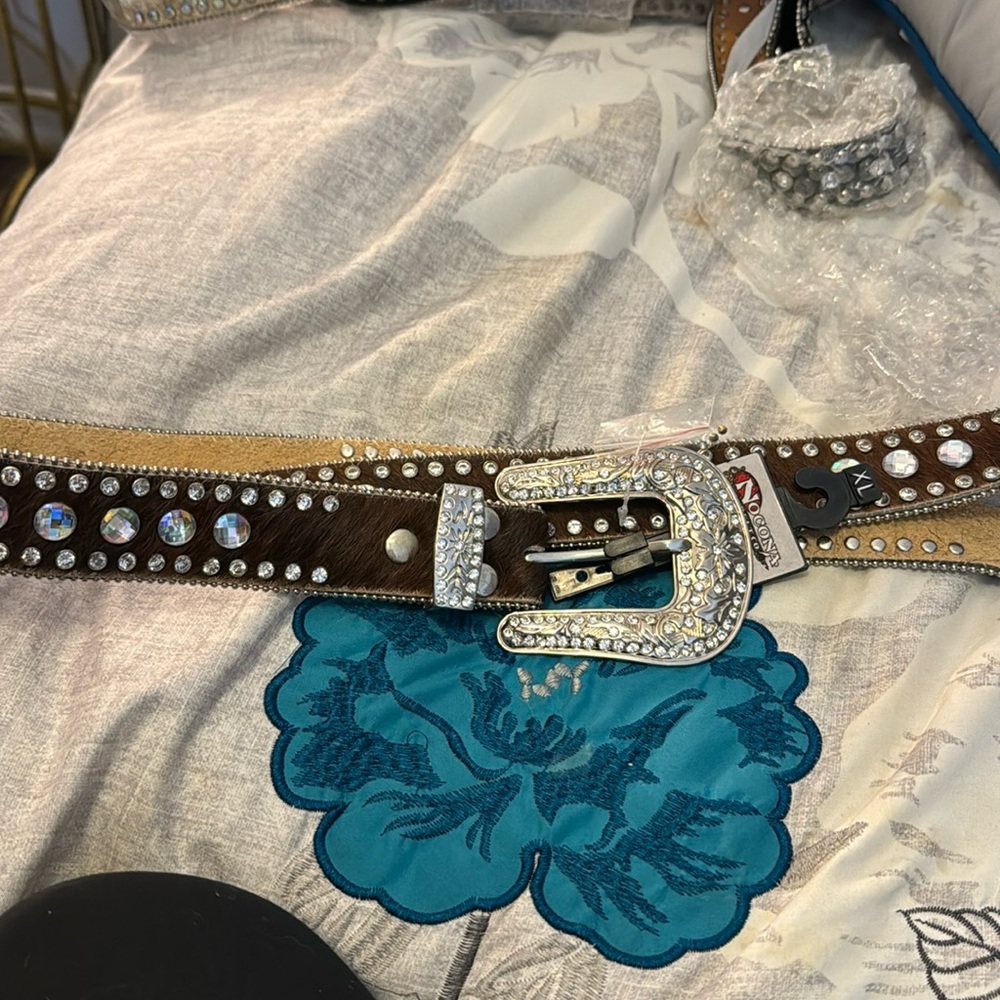 New with tags.  Beautiful brown bling belt.  Size XL